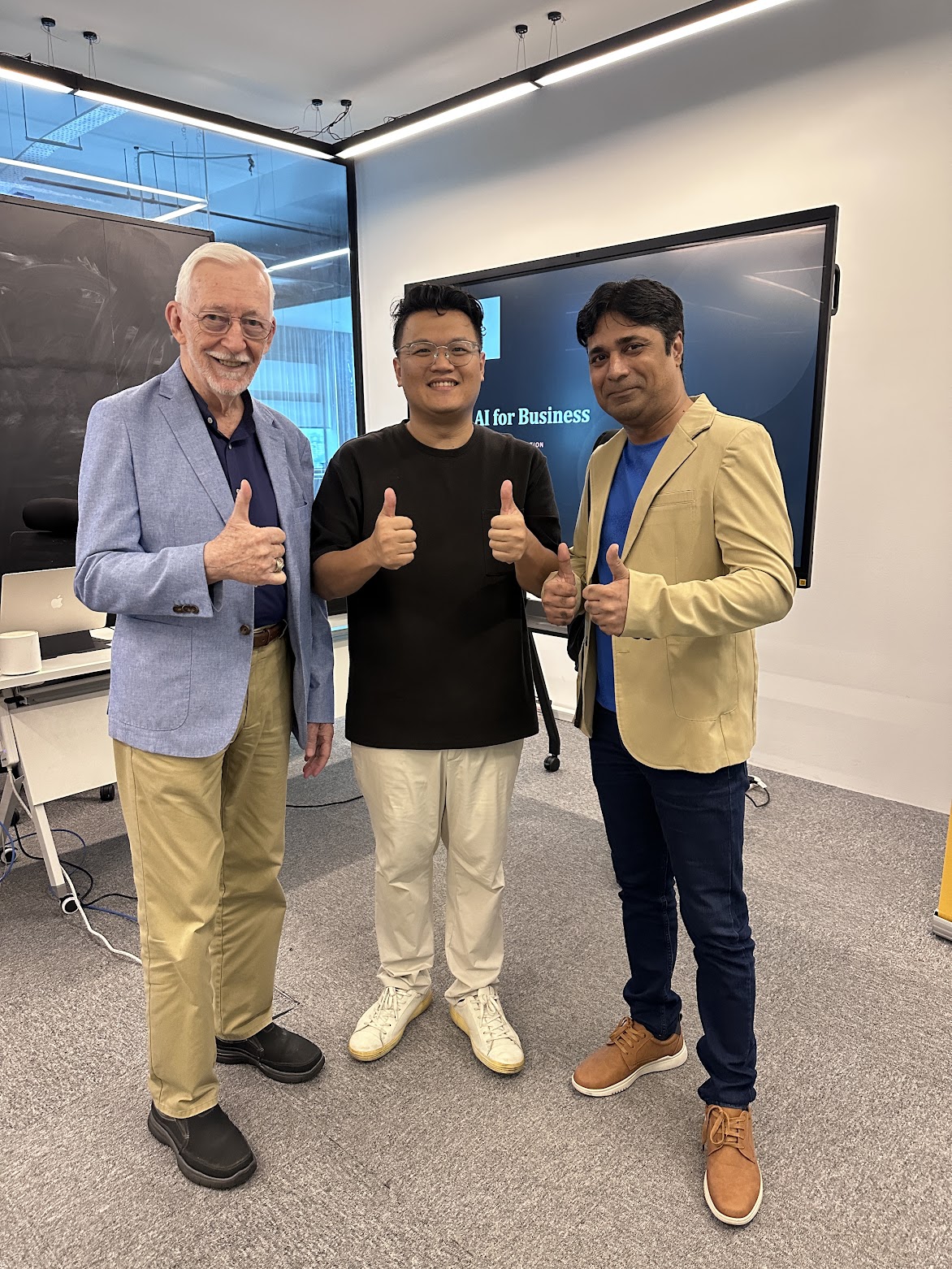 Kenny with two people at an AI workshop